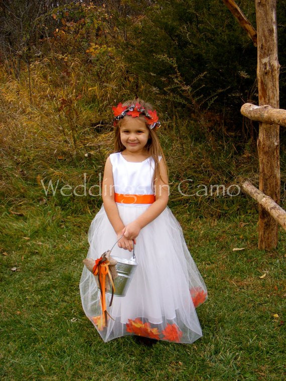 flower girl with white tulle dress with leaves
