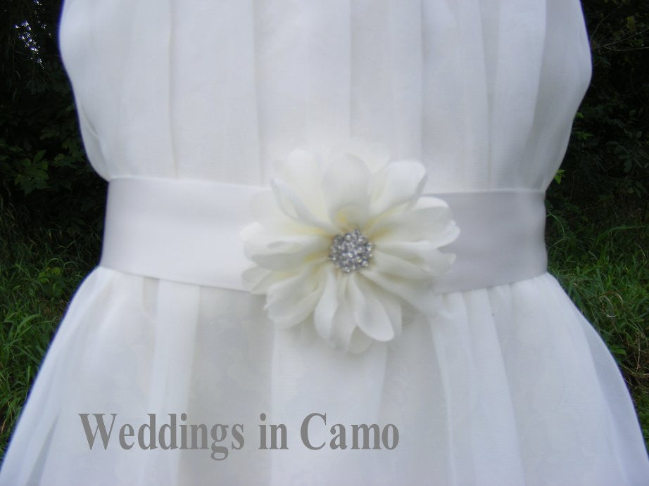 ribbon belt with a flower accented with a rhinestone