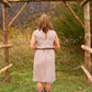 short bridesmaid dress shown with boots